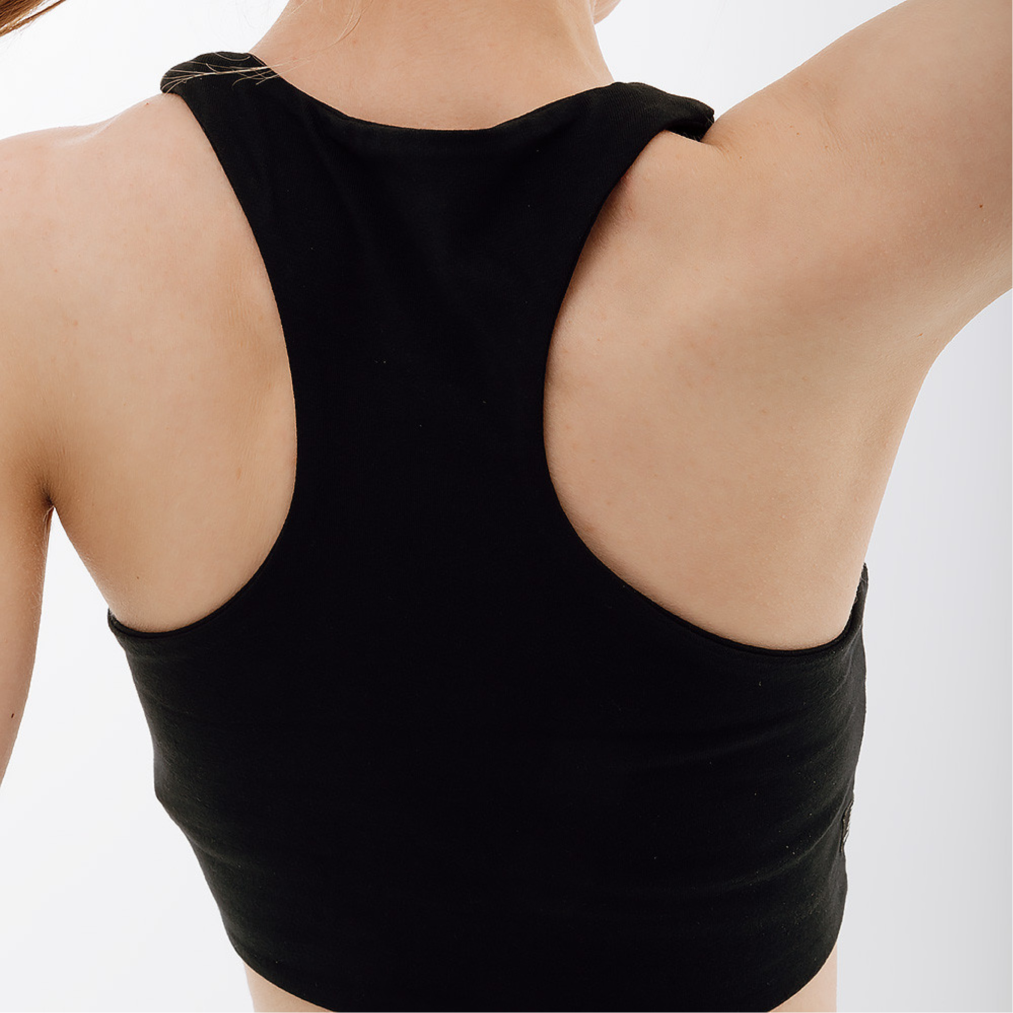 Жіночий Топ New Balance Essentials Reimagined Bra Чорний L (7dWB31500BK L) - 2 - Robinzon.ua